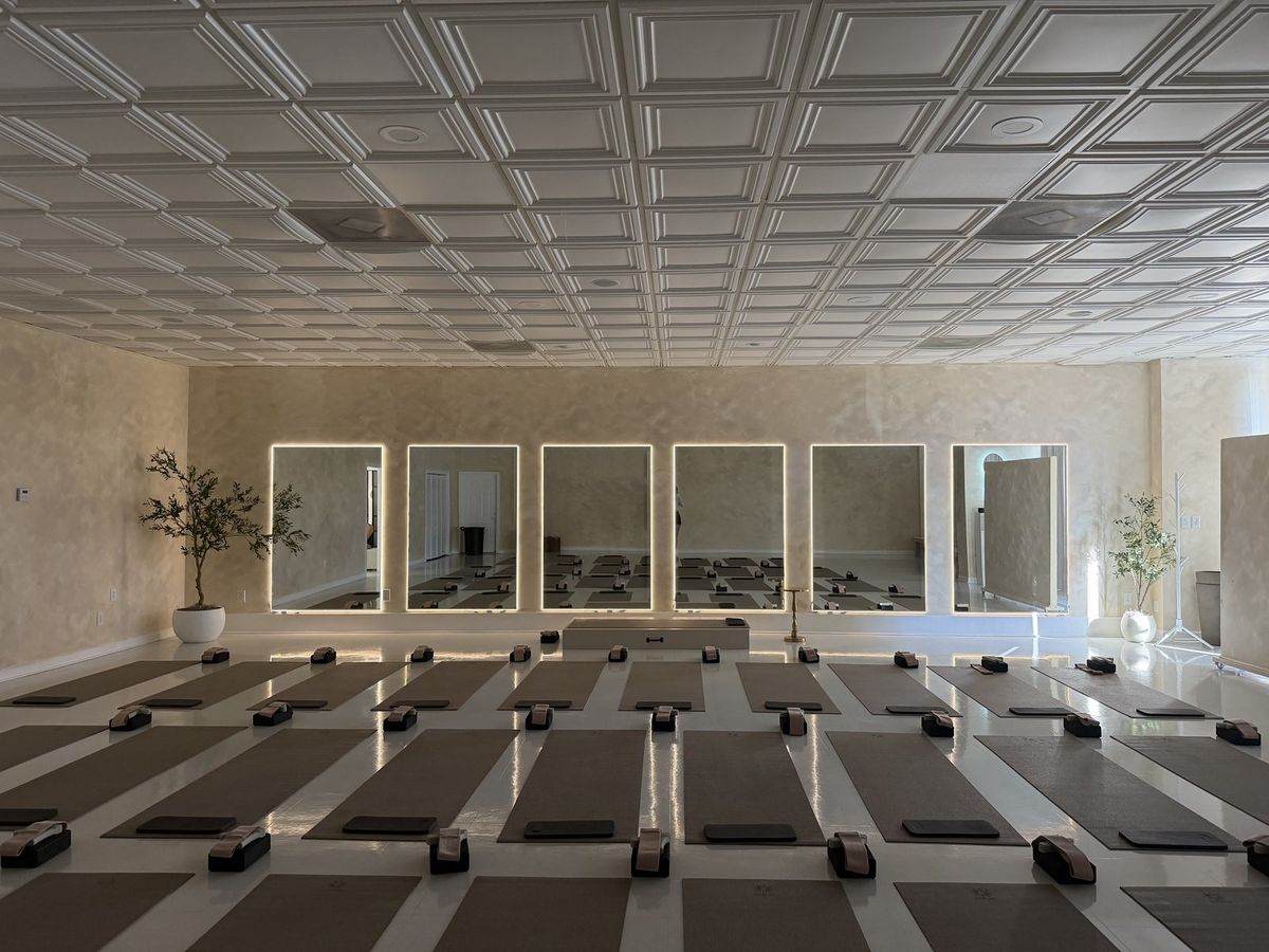 Yoga studio with a row of mirrors installed
